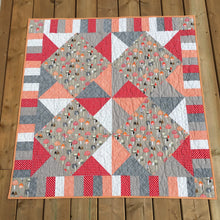 Load image into Gallery viewer, Canadian Diamond quilt pattern by Penny Spool Quilts, featuring four large diamonds surrounded by half-square triangles and a pieced border. Quilt shown in beige mushroom print with red, white, orange and grey accents.
