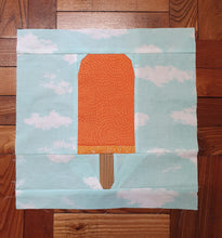 Load image into Gallery viewer, Ice Cream Bar 1 foundation paper pieced quilt block pattern by Penny Spool Quilts. orange creamsicle on light blue background fabric with white clouds