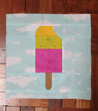 Load image into Gallery viewer, Popsicle 2 quilt block pattern by Penny Spool Quilts. Part of the Ice Cream Sunday collection. Tri-coloured popsicle with a bite taken out in top right corner, in yellow, green and pink Alison Glass print fabrics on light blue background.