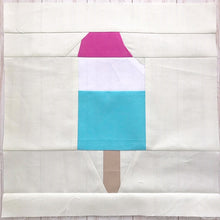Load image into Gallery viewer, Popsicle 2 quilt block pattern by Penny Spool Quilts. Part of the Ice Cream Sunday collection. Tri-coloured popsicle with a bite taken out in top right corner, in pink, white and blue solid fabrics on cream background.