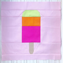 Load image into Gallery viewer, Popsicle 1 quilt block pattern by Penny Spool Quilts. Part of the Ice Cream Sunday collection. Tri-coloured popsicle in bright yellow, orange and pink solid fabrics on light pink background.