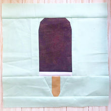 Load image into Gallery viewer, Ice Cream Bar 1 foundation paper pieced quilt block pattern by Penny Spool Quilts. Purple and white ice cream bar on light blue background.