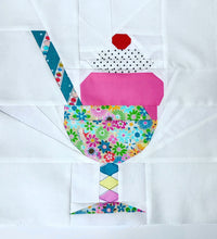 Load image into Gallery viewer, Ice Cream Bowl quilt block pattern by Penny Spool Quilts. Part of the Ice Cream Sunday collection. Sample shows bright pink ice cream topped with black polka dot whipped cream and a red cherry, with striped blue straw, in a floral bowl with stem, on white background.
