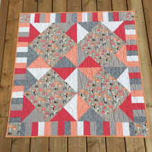Load image into Gallery viewer, Canadian Diamond quilt pattern by Penny Spool Quilts, featuring four large diamonds surrounded by half-square triangles and a pieced border. Quilt shown in beige mushroom print with red, white, orange and grey accents.
