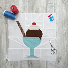 Load image into Gallery viewer, Ice Cream Bowl quilt block pattern by Penny Spool Quilts. Part of the Ice Cream Sunday collection. Sample shows chocolate ice cream topped with whipped cream and a red cherry, and a striped chocolate wafer straw, in a turquoise bowl with stem, on white background. Shown with spools of thread, pins and small scissors

