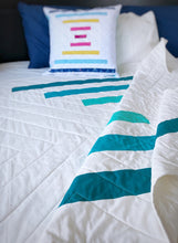 Load image into Gallery viewer, Raise the Bar quilt pattern by Penny Spool Quilts - Sample quilt in turquoise ombre and white, and sample pillow wit multicoloured stripes

