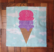Load image into Gallery viewer, Ice Cream Cone quilt block pattern by Penny Spool Quilts. Part of the Ice Cream Sunday collection. Light brown wafer cone with one scoop of purple ice cream and one scoop of pink ice cream, on light blue background.
