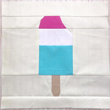 Load image into Gallery viewer, Popsicle 2 quilt block pattern by Penny Spool Quilts. Part of the Ice Cream Sunday collection. Tri-coloured popsicle with a bite taken out in top right corner, in pink, white and blue solid fabrics on cream background.
