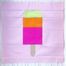 Load image into Gallery viewer, Popsicle 1 quilt block pattern by Penny Spool Quilts. Part of the Ice Cream Sunday collection. Tri-coloured popsicle in bright yellow, orange and pink solid fabrics on light pink background.
